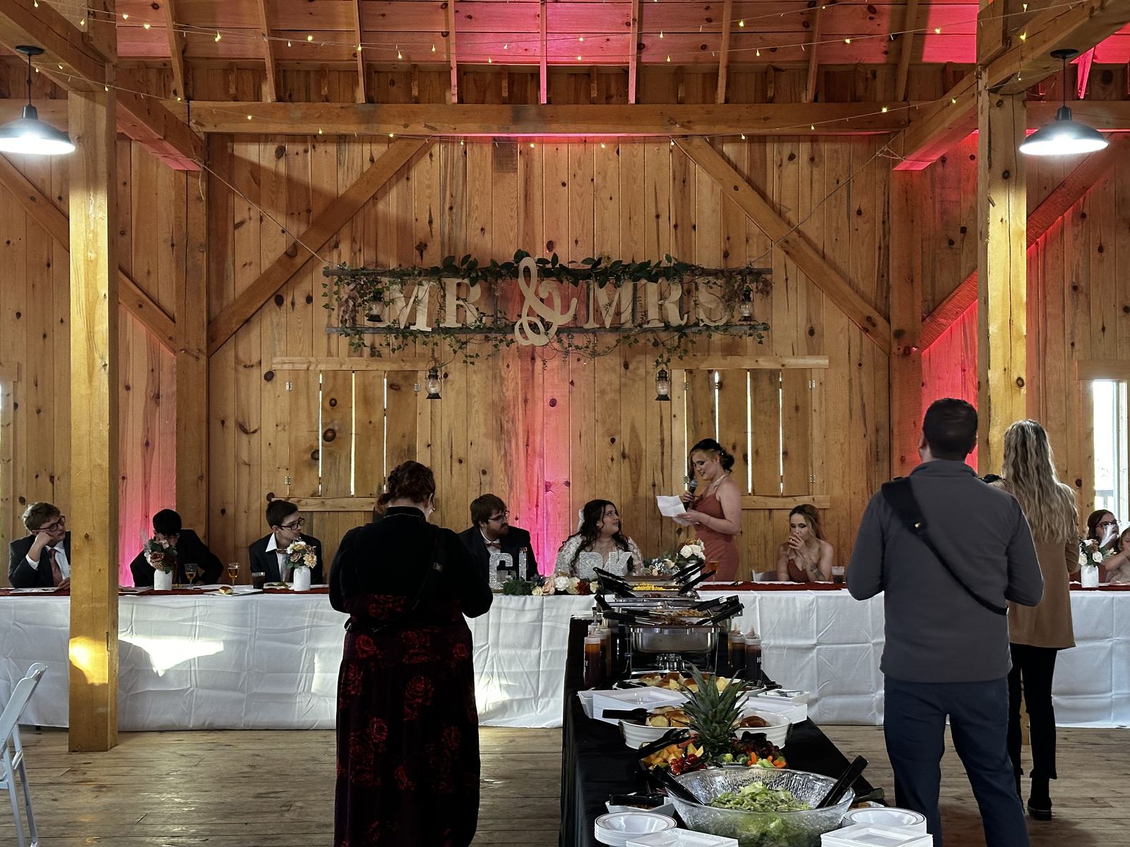 Buffet and service area prepared for a barn wedding reception