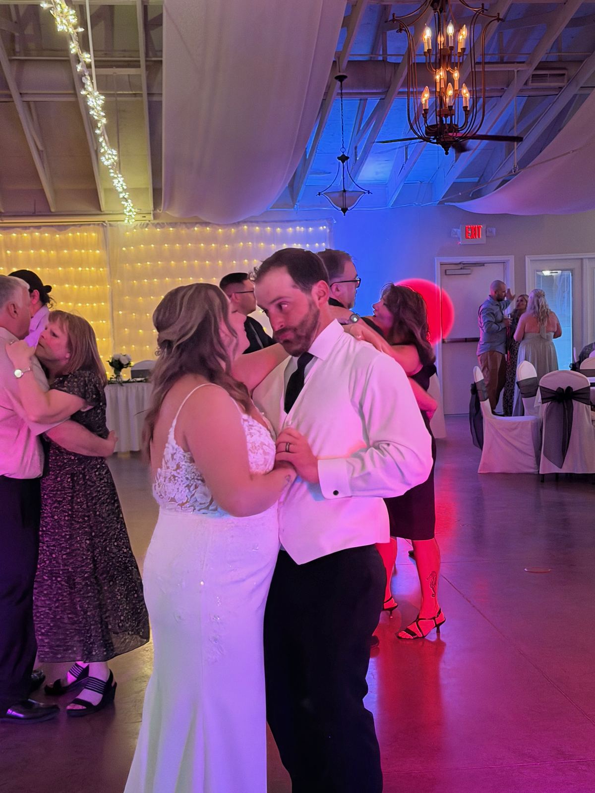 Bride dancing with guests during her wedding reception