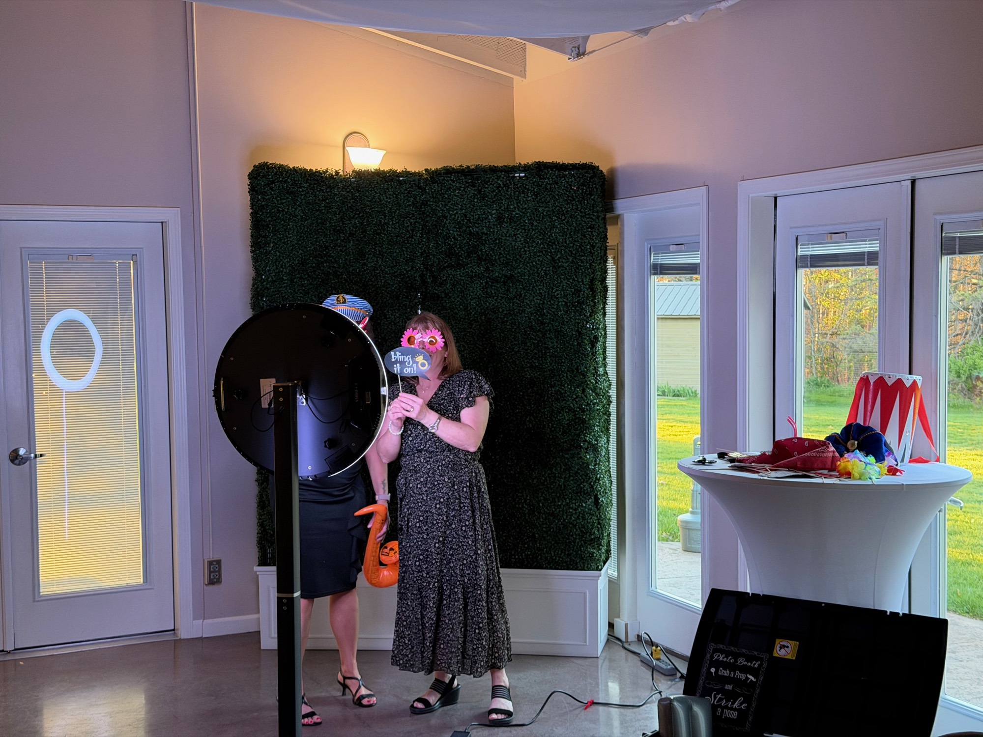 A guest using the ring-light photo booth during a wedding reception