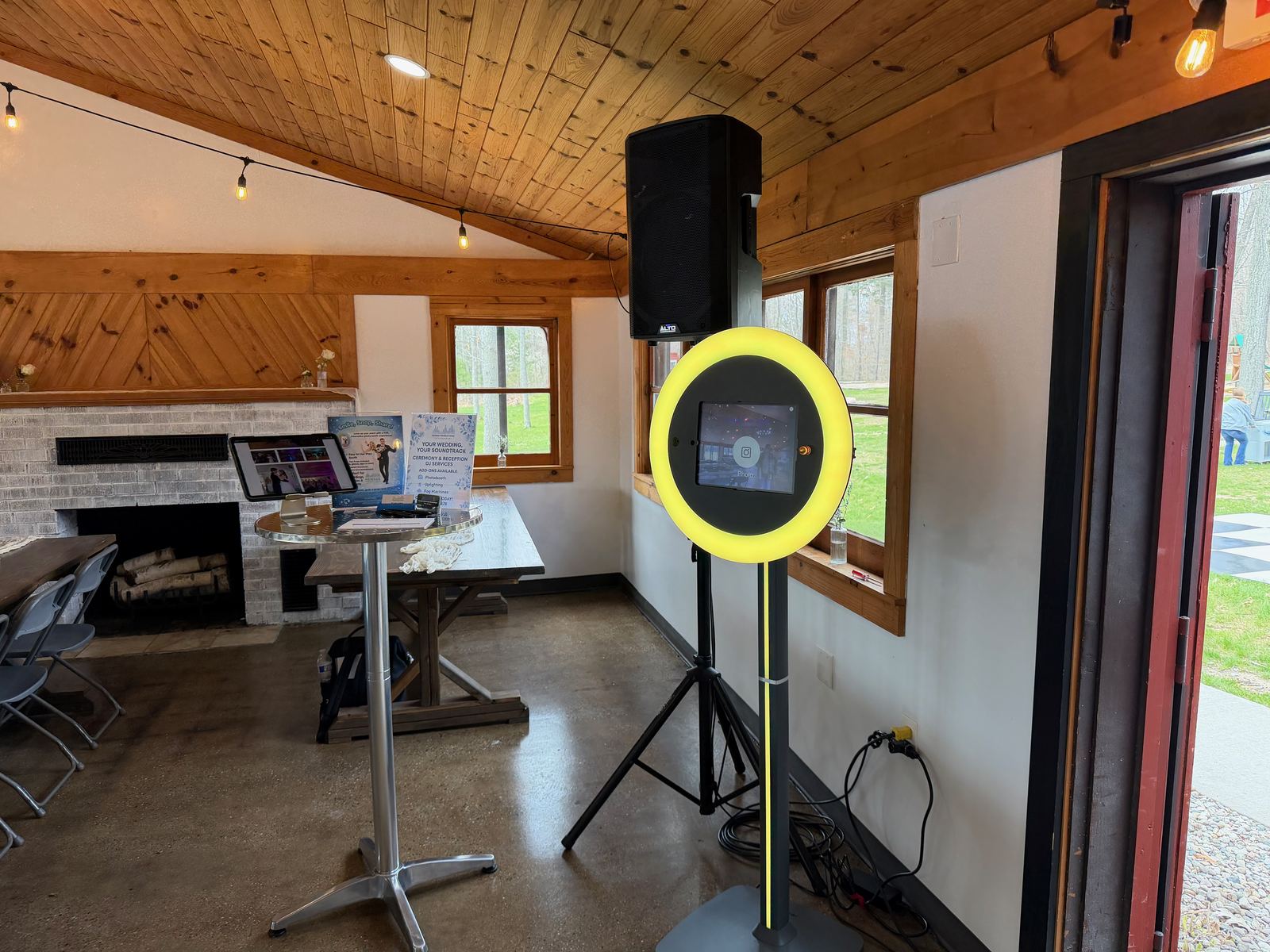 Open-house photo booth with ring light, backdrop, and guest station