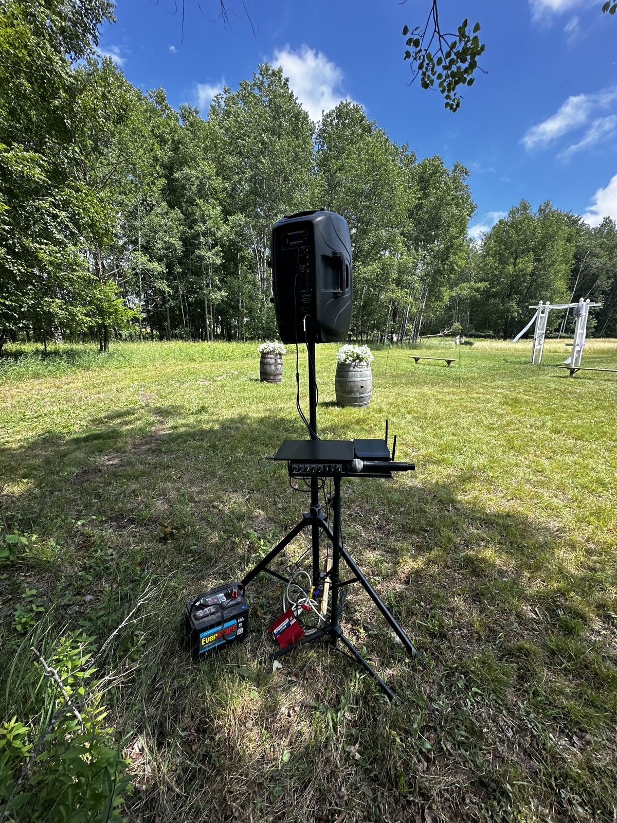 Complete outdoor wedding setup with ceremony area and reception tent
