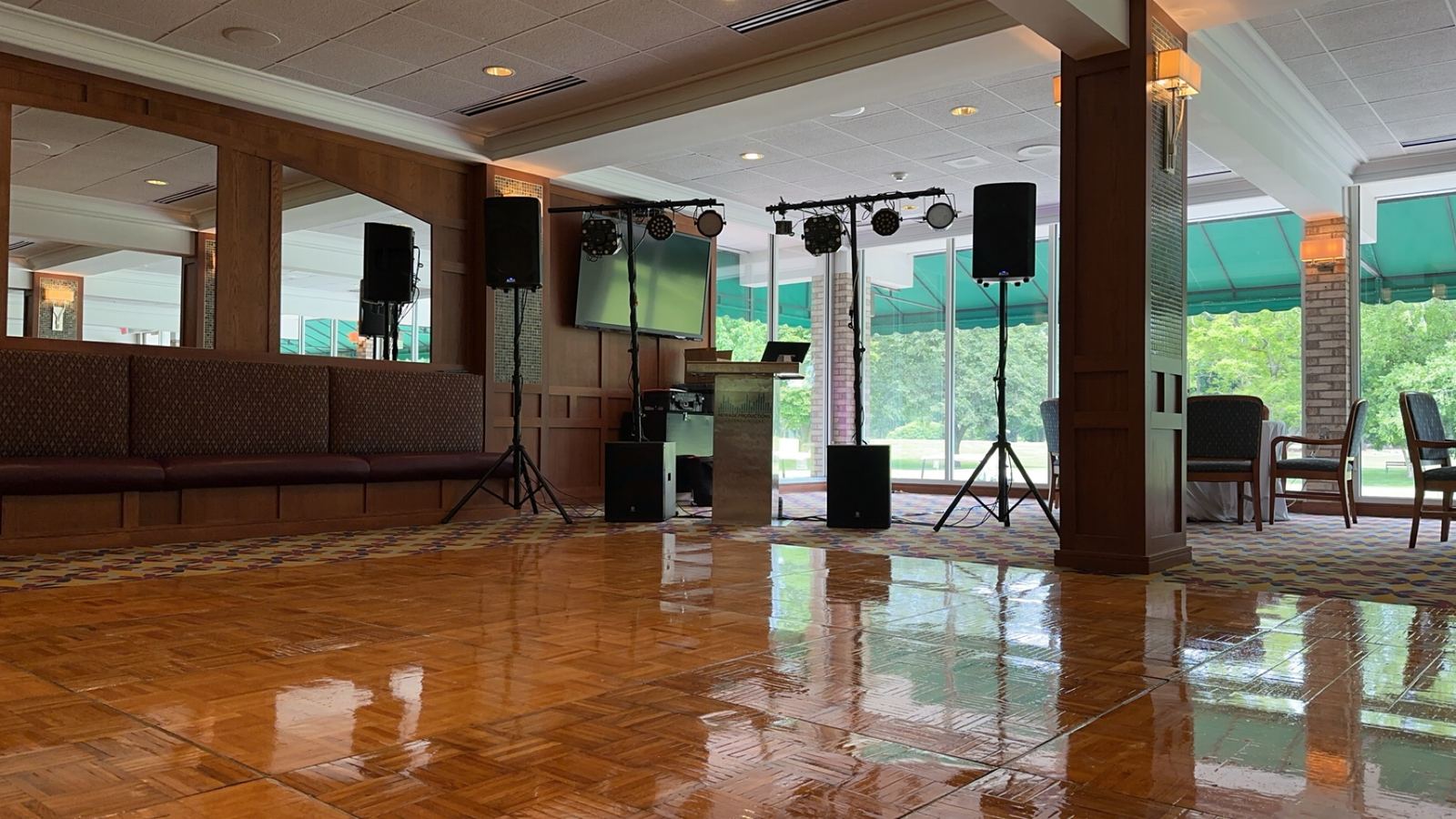 Vertical view of a reception room prepared with tables and an open dance floor