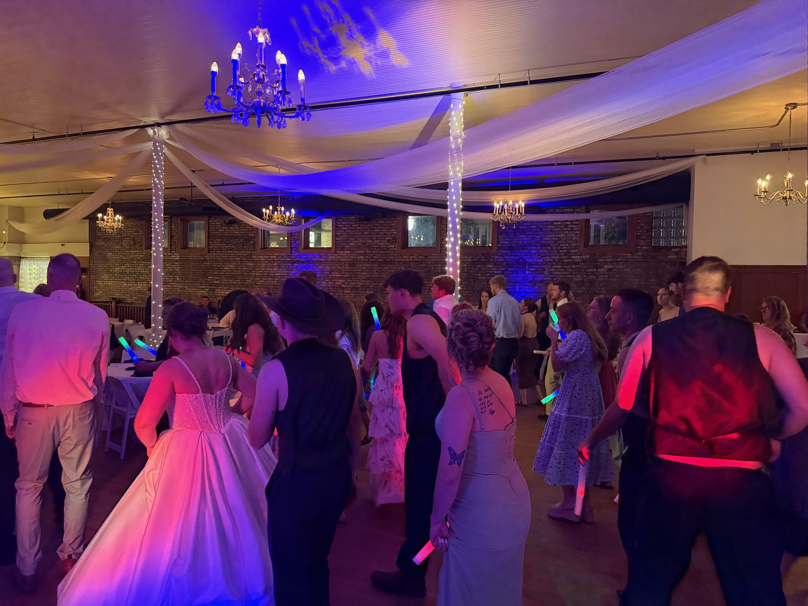 Wide view of guests celebrating on the Snyder wedding dance floor