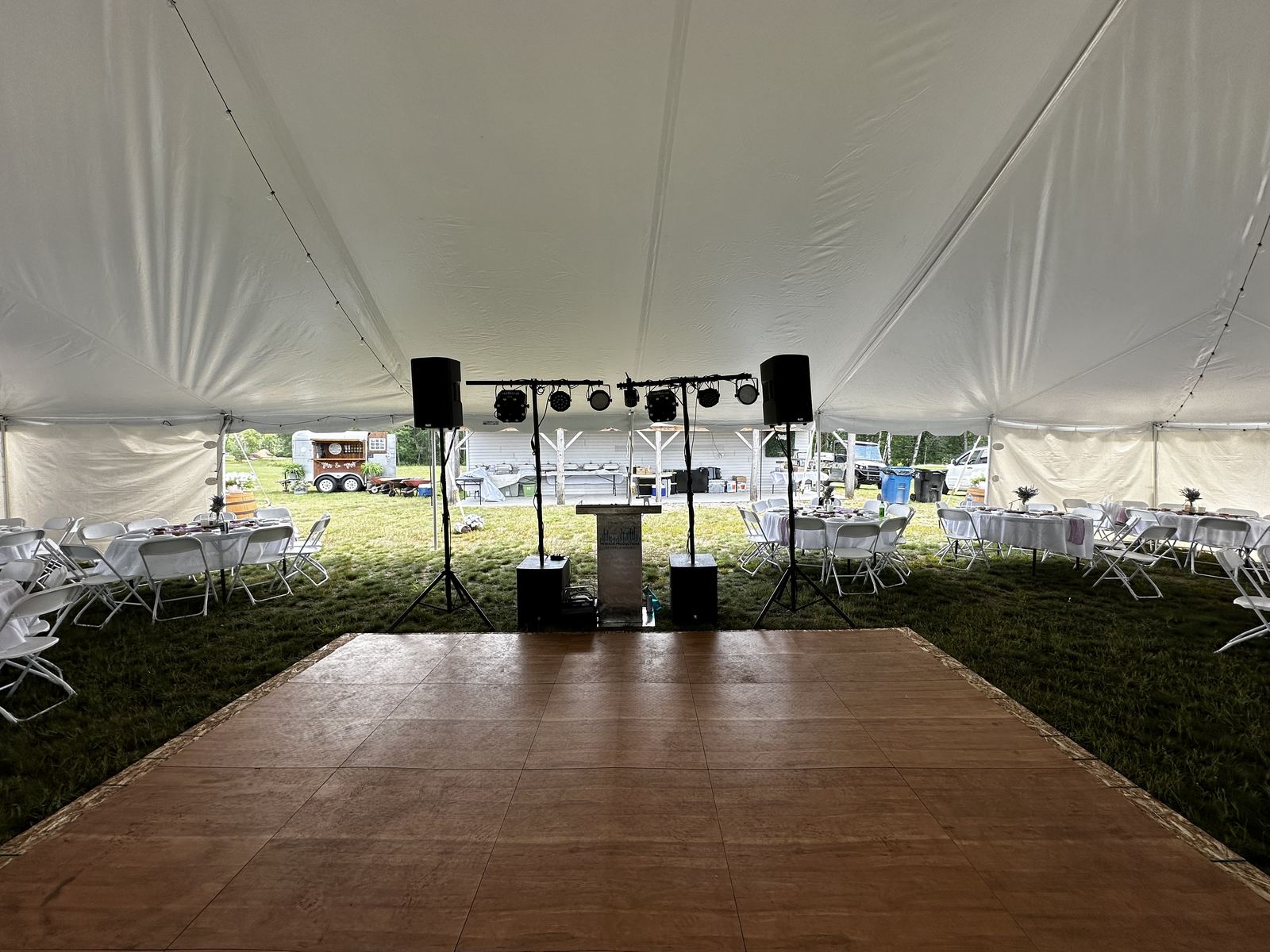 Tent reception décor and guest tables ready before the celebration