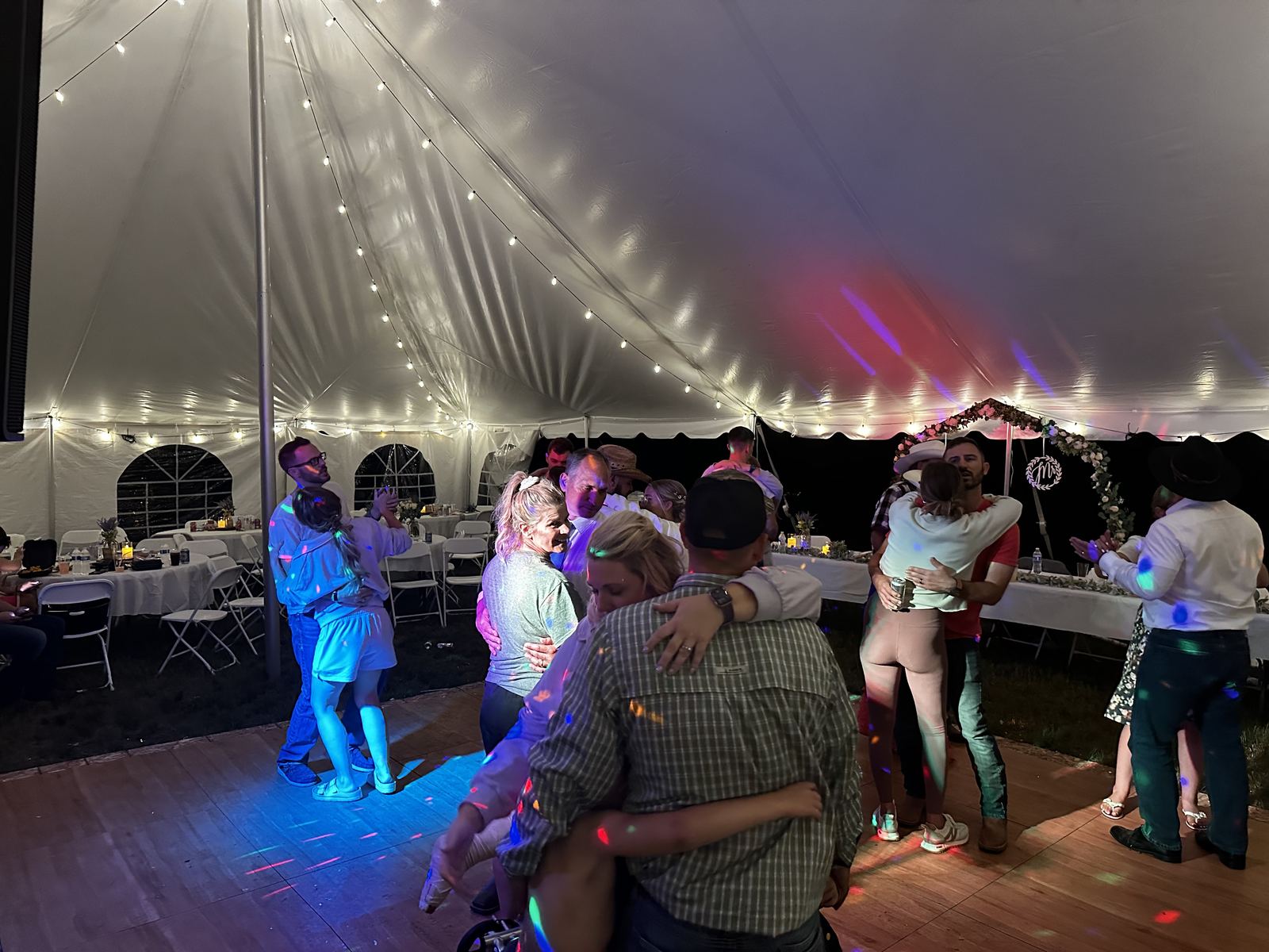 Guests celebrating late into a tent wedding reception