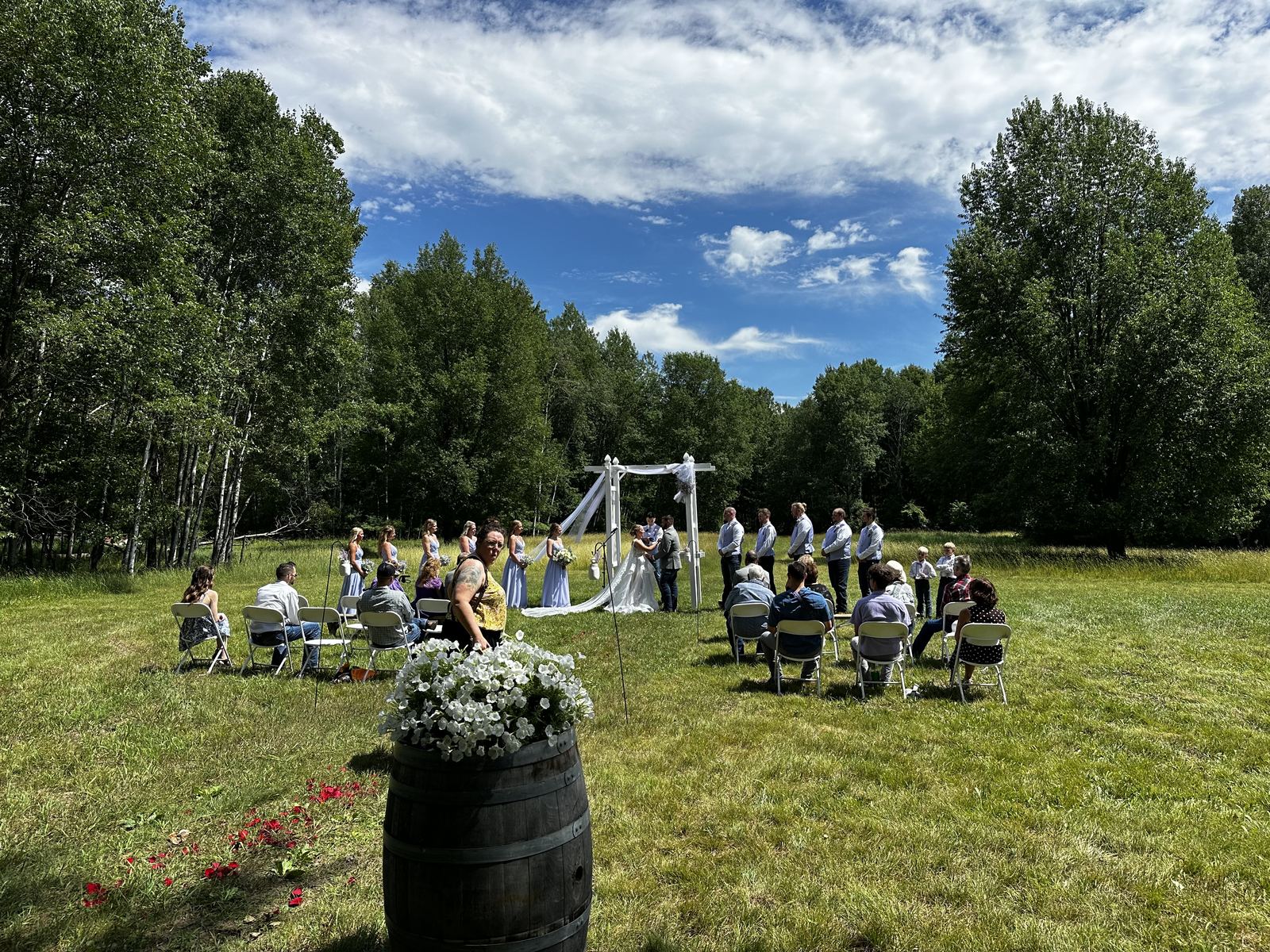 Wedding details arranged beneath a white reception tent